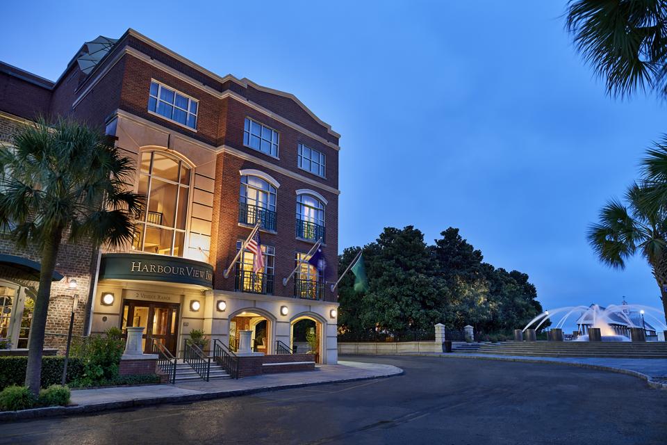 The exterior of HarbourView Inn at sunset.