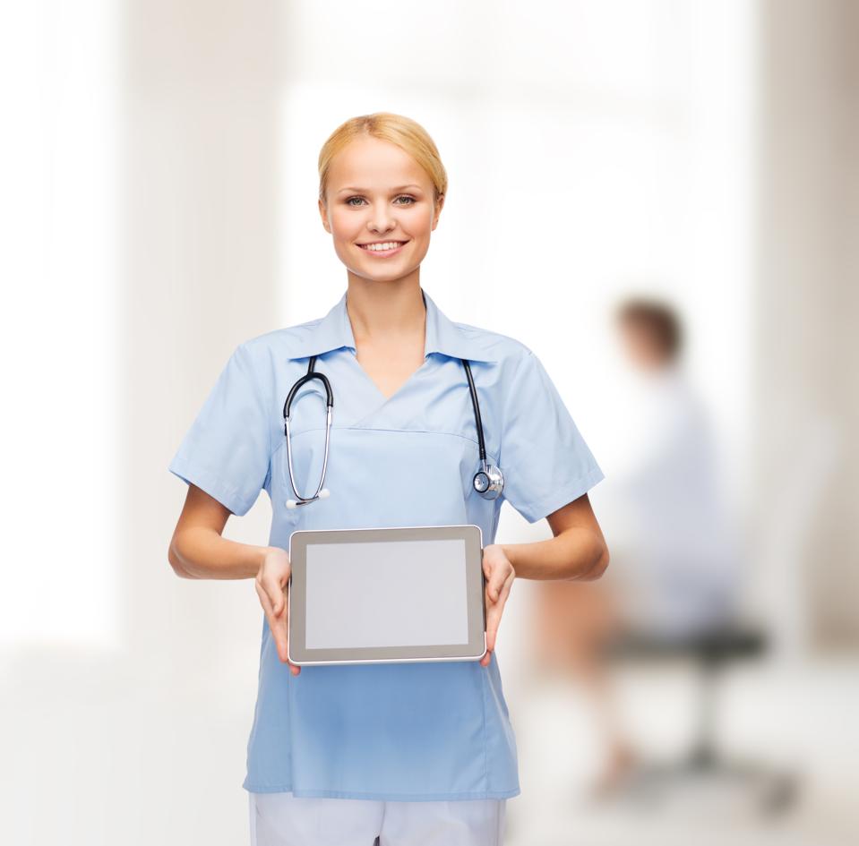 smiling female doctor or nurse with tablet pc