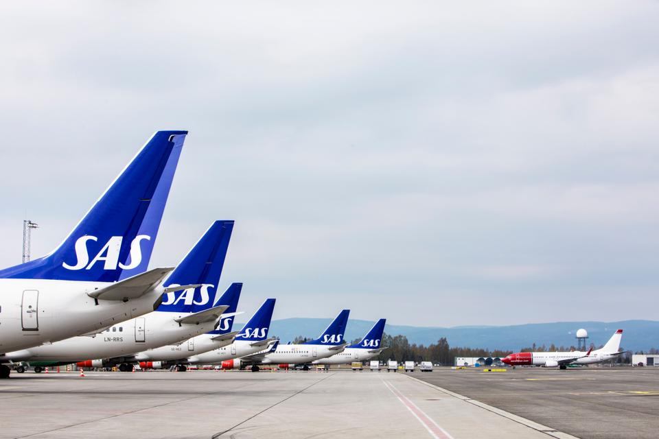 Scandinavian Airlines SAS airplanes parked on the tarmac at Oslo Airport, Norway.