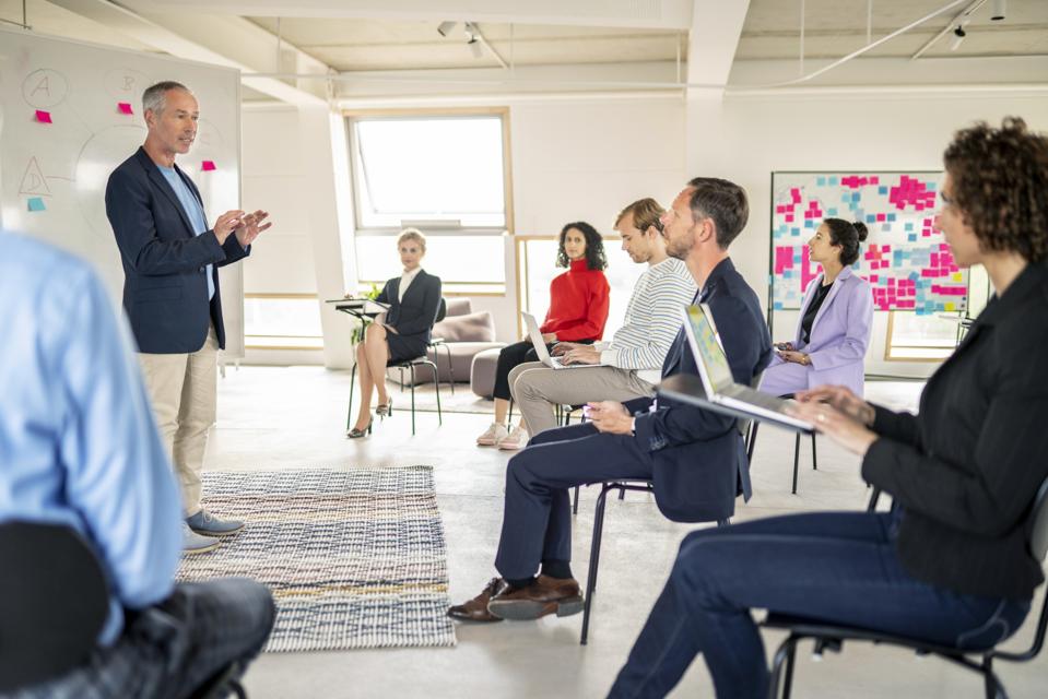Group in a lecture in beautiful workspace
