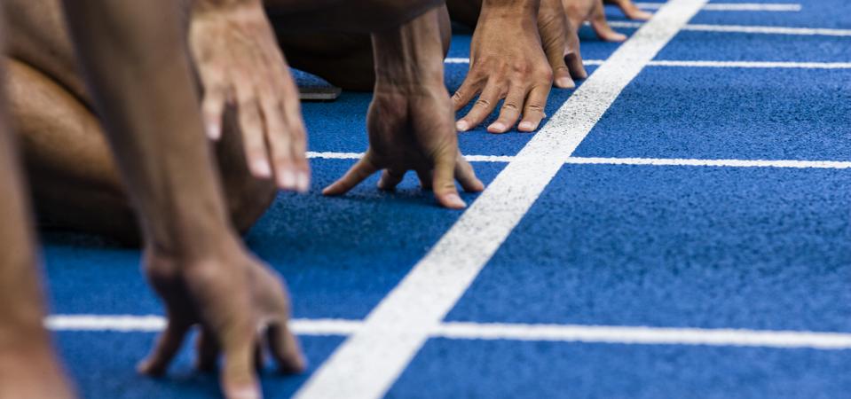 Track sprinters lined up at starting