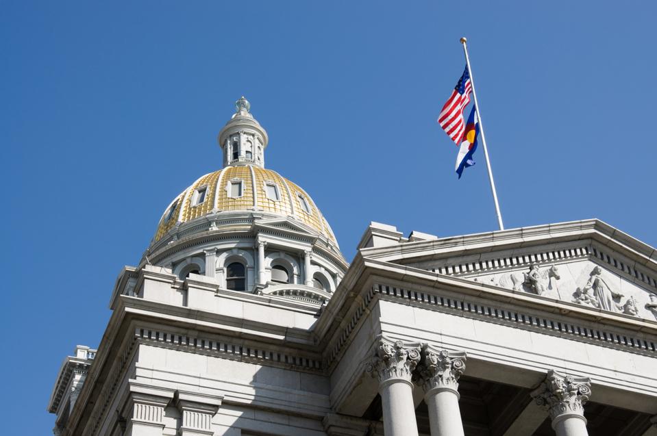 Colorado capitol building and US flag and CO flag