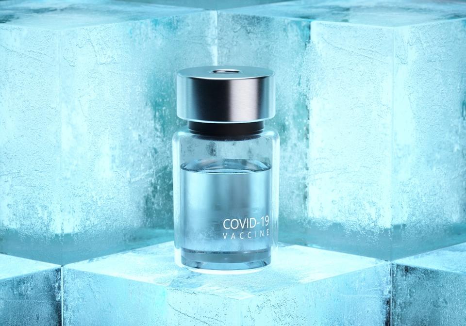 Covid-19 vaccine bottles on ice cubes.