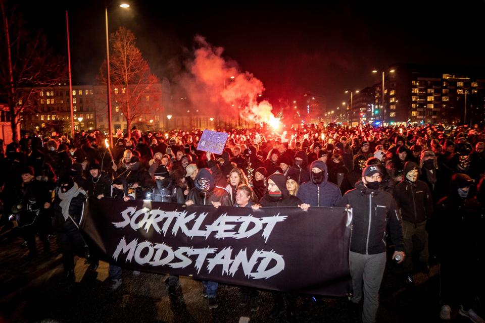 Demonstrators march against Covid-19 restrictions introduced by the Danish government in Copenhagen on January 23, 2021.