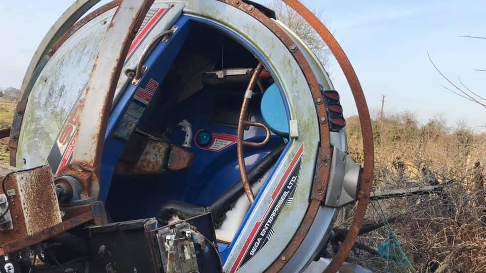 A Sega R360 arcade cabinet in a field in Northern Ireland