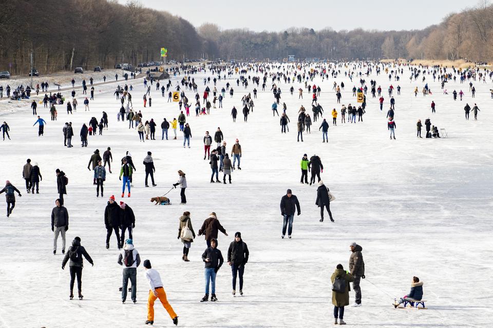 Skaters on the Bosbaan on February 14, 2021 in Amsterdam, Netherlands.
