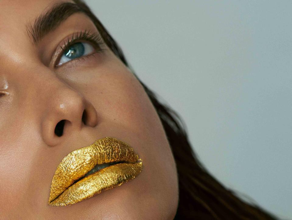 Irina Shayk is wearing the 24K Pure Gold Lip Treatment
