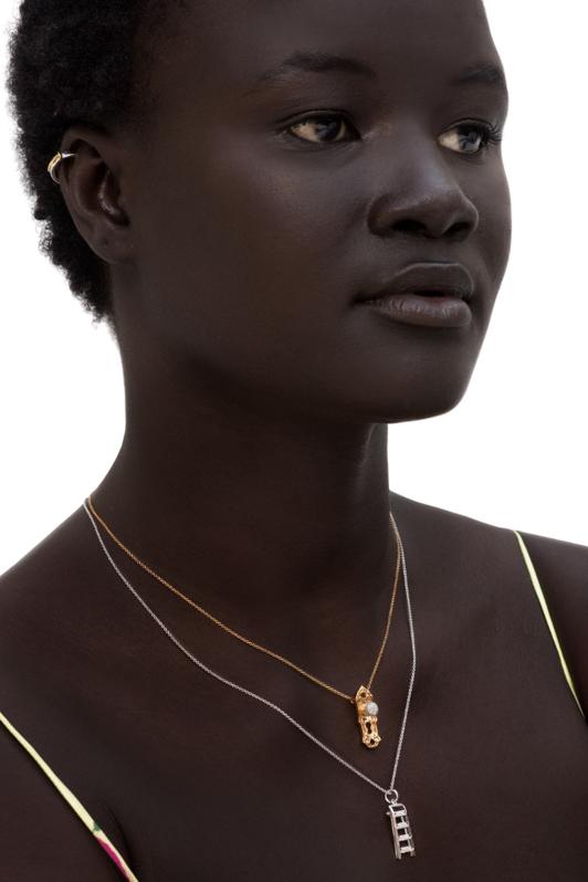 A model wears necklaces from the Empower Tools collection, Pavé the Way by Joan Hornig.