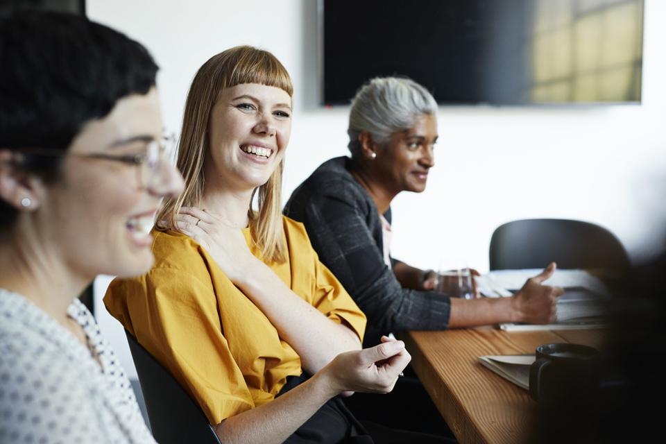 coworkers in office meeting