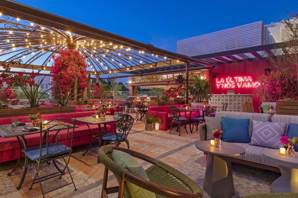 A colorful outdoor restaurant located on the hotel's second-floor terrace.
