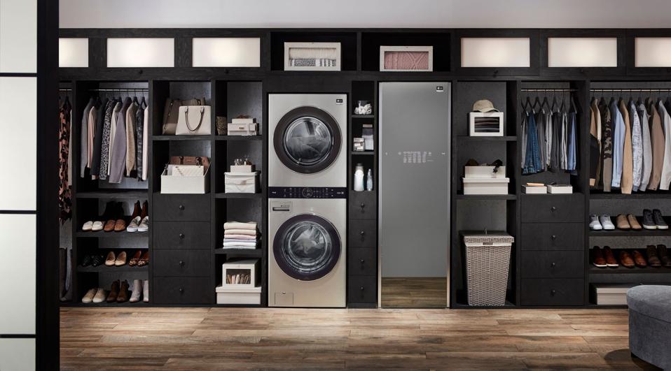 Stacked washer-dryer set with central controls.