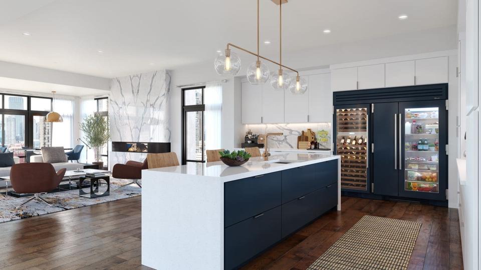 Luxury kitchen with colorful cabinets and appliances.