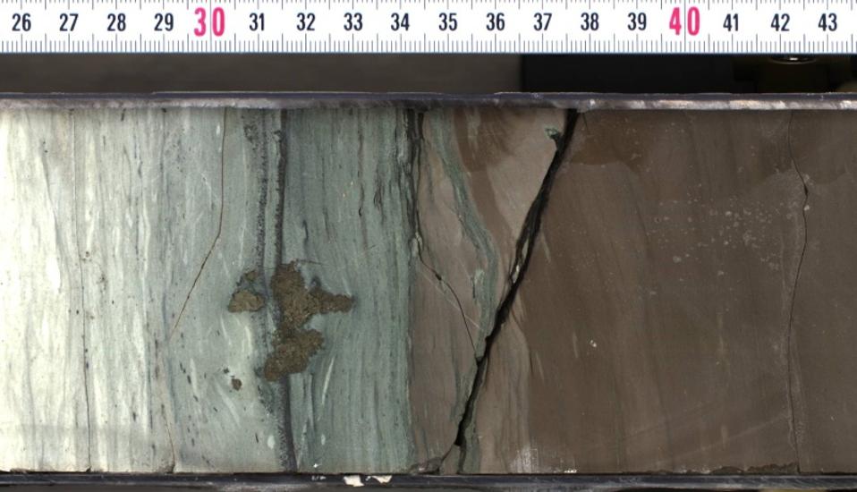 A section of rock core pulled from the crater left by the asteroid impact that wiped out the dinosaurs. Researchers found high concentrations of the element iridium –a marker for asteroid material –in the middle section of the core that contains a mixture of ash from the impact and ocean sediment deposited over decades.