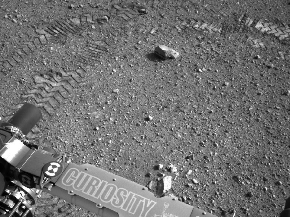 This image shows a close-up of track marks from the first test drive of NASA's Curiosity rover—and within is Morse code.