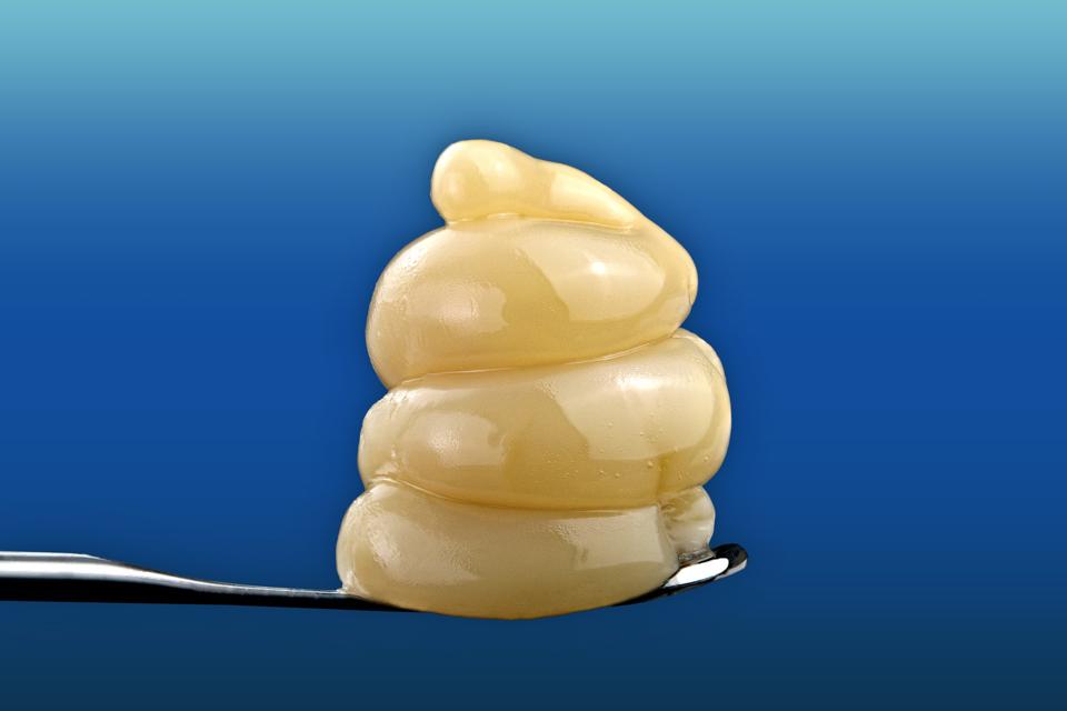 A swirl of LA Wedding Pop cannabis concentrate cultivated and extracted by Happy Cabbage Farms perched on a dabbing tool.