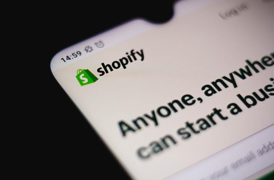 In this photo illustration a Shopify company website seen...