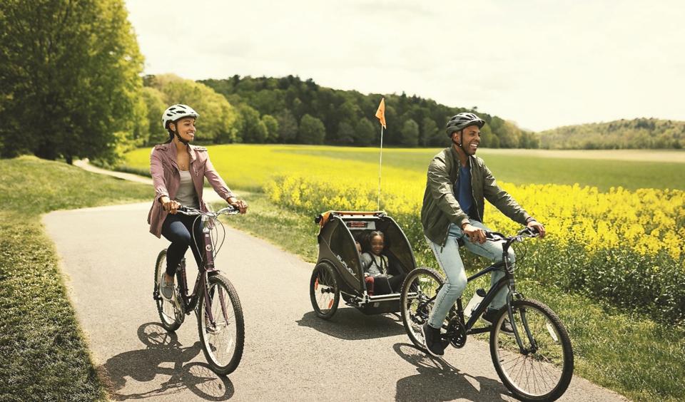Family riding bikes at the Biltmore Estate.