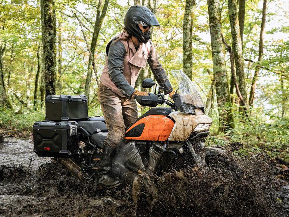 Harley-Davidson Pan America being ridden through a mud puddle