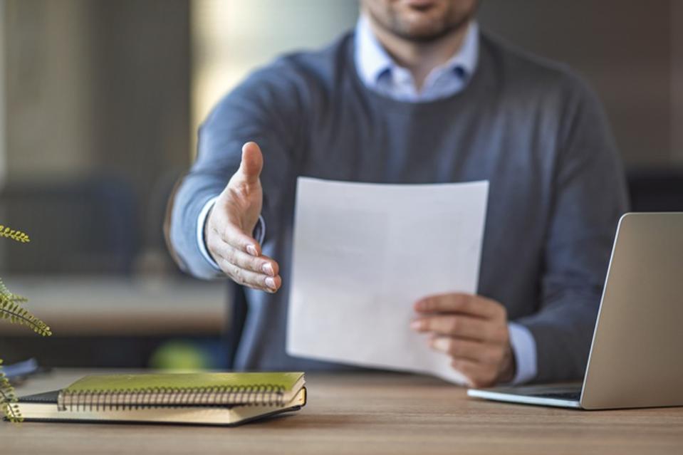 Businessman with an open hand ready for handshake
