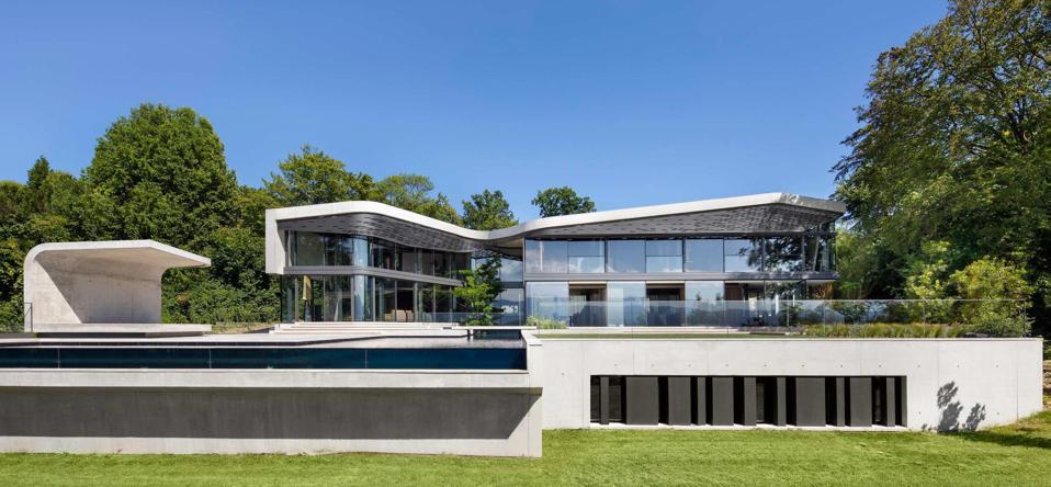 swimming pool and house villa courbe saota designed switzerland cologny house
