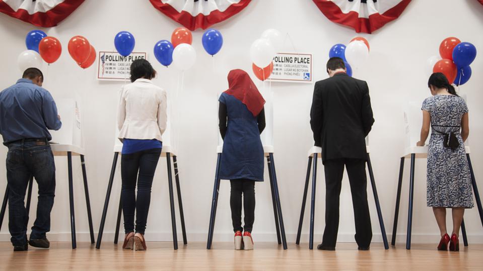 Voters voting in polling place