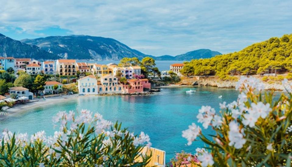 Scenic View Of Sea And Buildings Against Cloudy Sky in Kefalonia, Greece
