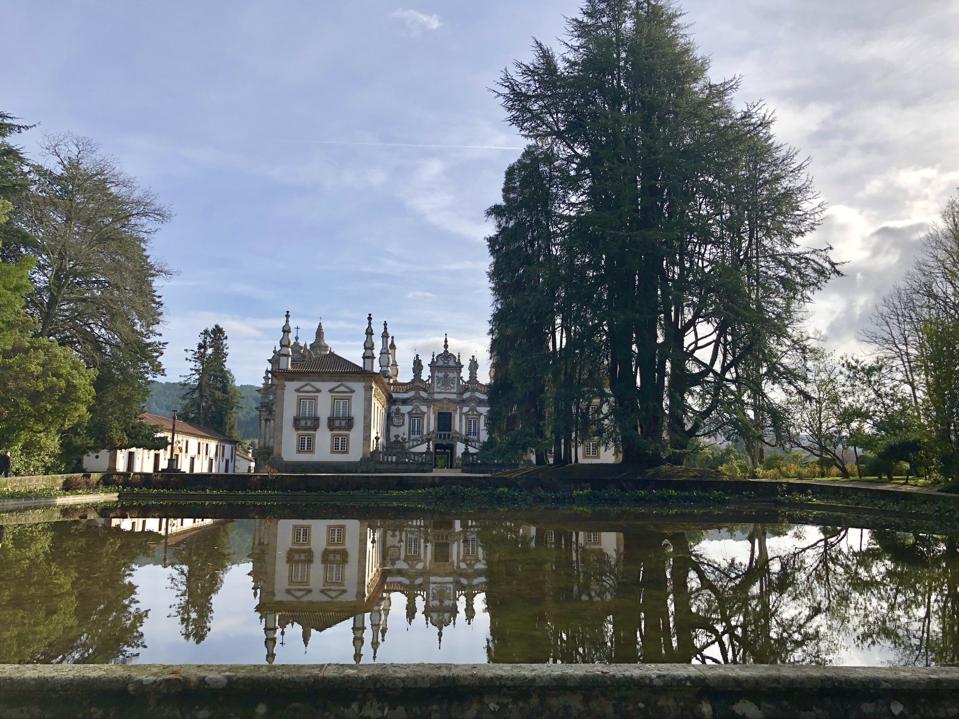 Mateus Palace in Portugal is reflected in the pool in front of it.
