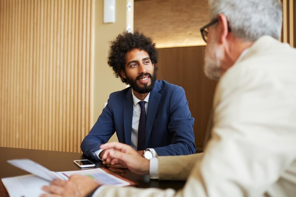 Financial advisor meeting in a bank office.