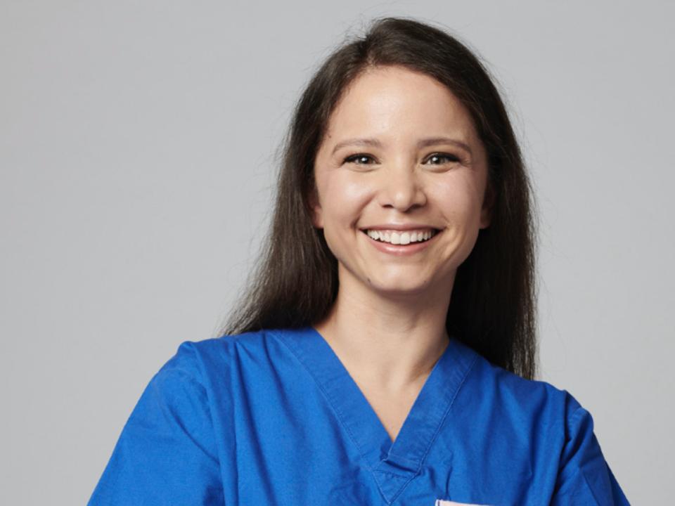 Headshot of Purzner in blue scrubs.