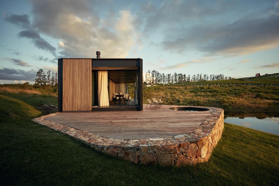 Single dwelling room on a rock with a wood patio