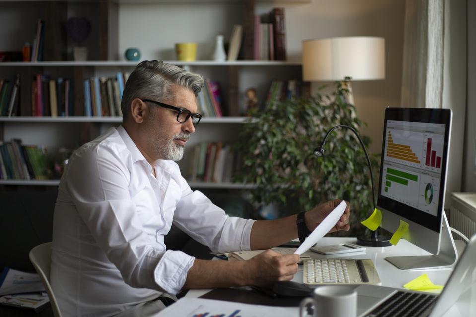 Man using desktop pc at desk in home office