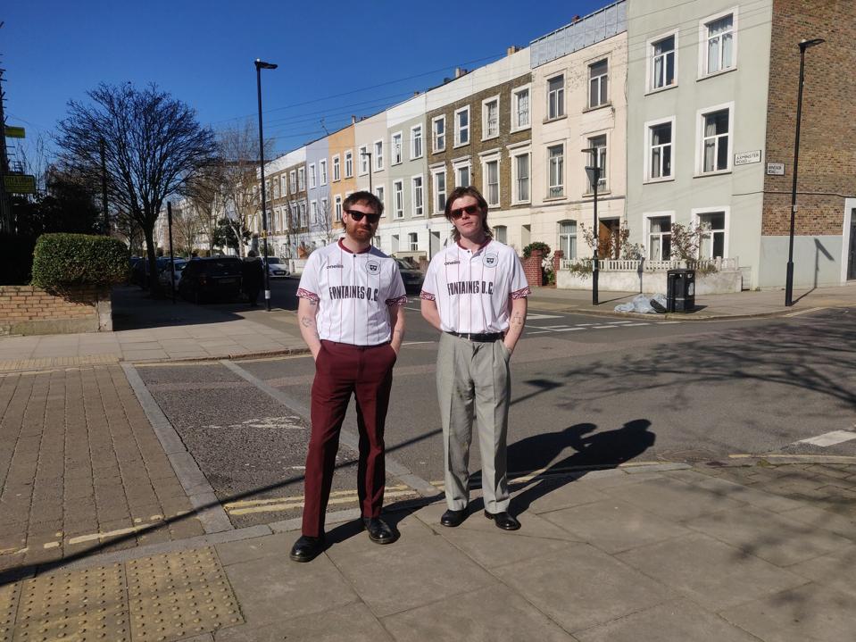 Tom Coll and Conor Curley of band Fontaines D.C. wear Bohemian FC jersey.