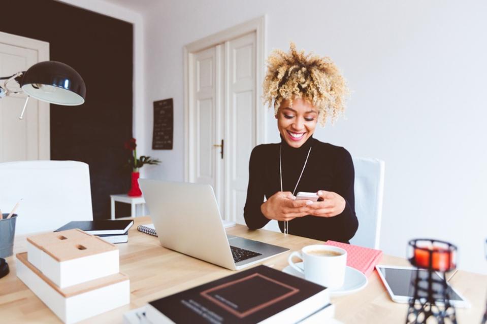 Afro american young woman in a home office