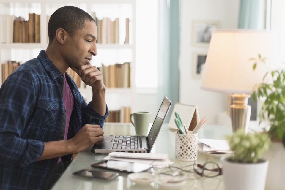 Businessman working on laptop at desk