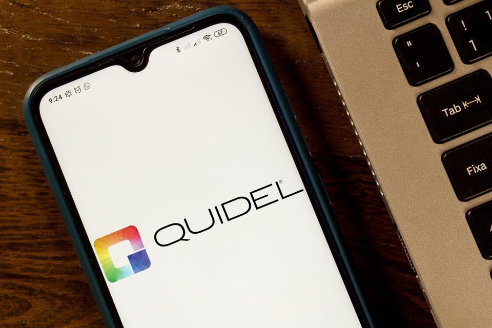 In this photo illustration the Quidel Corporation logo seen...