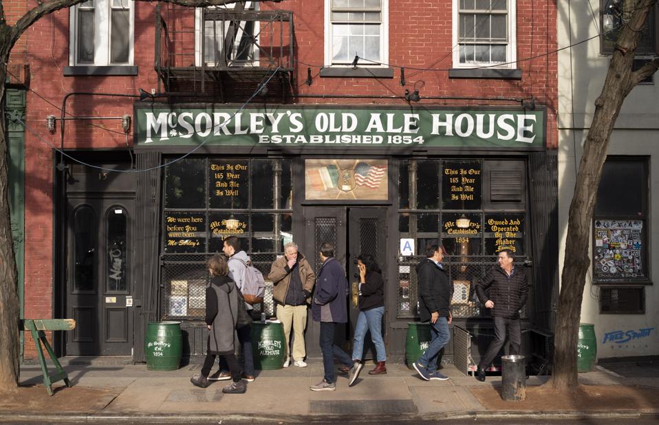 McSorley's Old Ale House on Manhattan's Lower East Side opened In the mid-19th Century, was a speakeasy during Prohibition and had plenty of customers in this December 2019 photo. (AP Photo/Mark Lennihan)