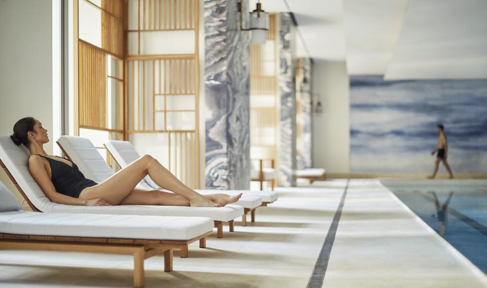 A woman at the pool at the New York Four Seasons Hotel.