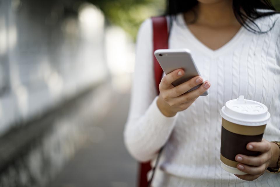 Woman using mobile phone outdoor
