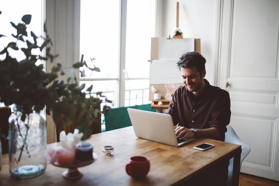 10 Remote Workplace Trends To Look Out For In 2021 2 10 Remote Workplace Trends To Look Out For In 2021 Young man working at home