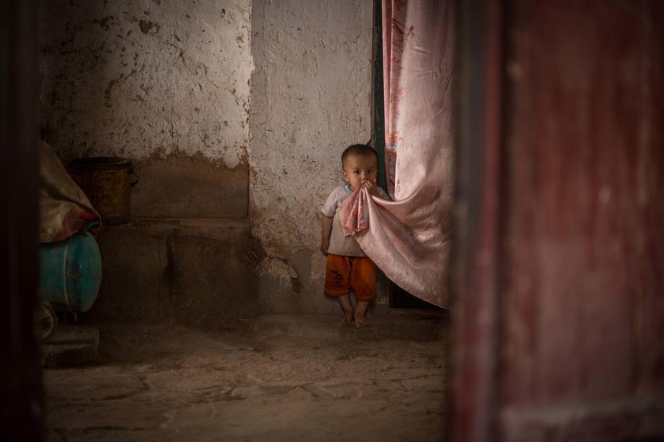 A Uyghur boy is pictured on the street of the Kashgar old...