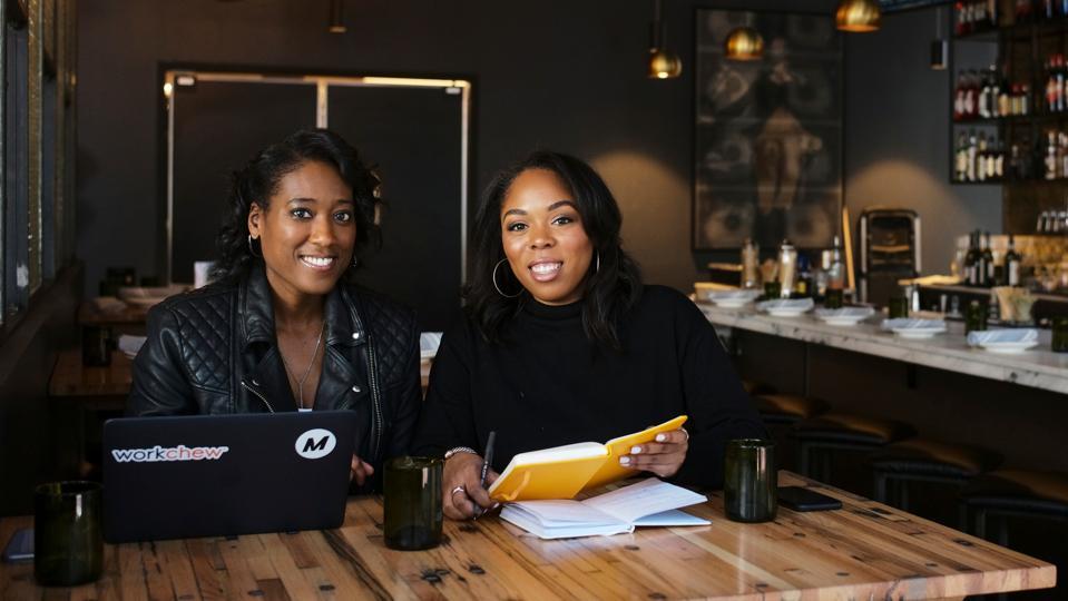 WorkChew Co-Founders Maisha Burt (left) and Allyson McDougal (right) working at a restaurant