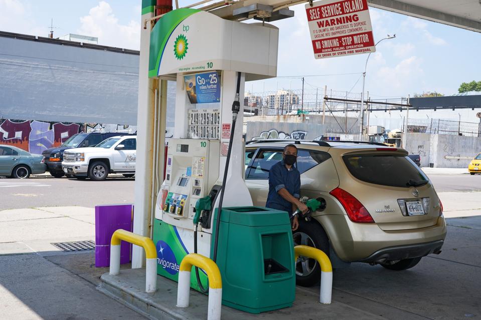 A motorist fills-up at a BP gas station in Queens Borough of...