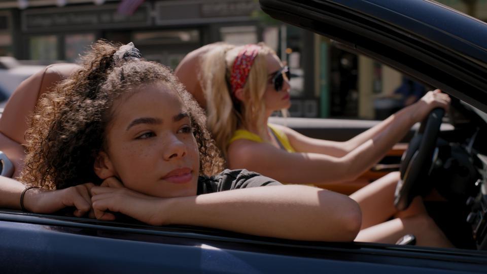 Georgia drives her daughter Ginny in a blue car