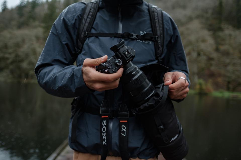 Man pulling camera out of waterproof case