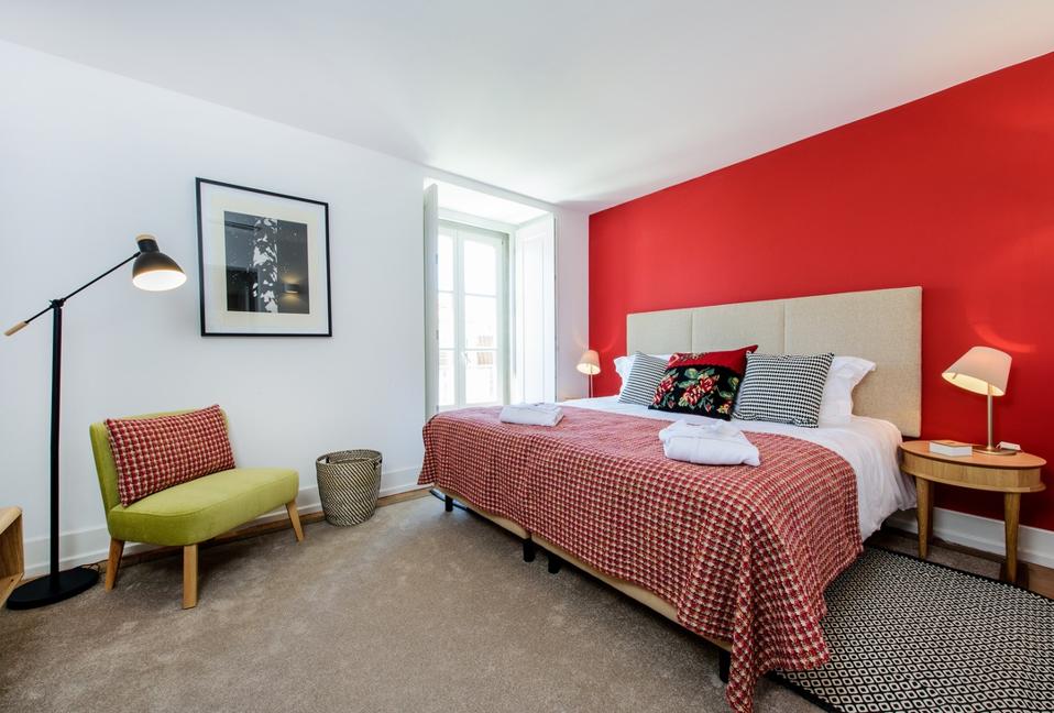 A wall of the Martinhal Chiado hotel in Lisbon, Portugal, is painted bright red