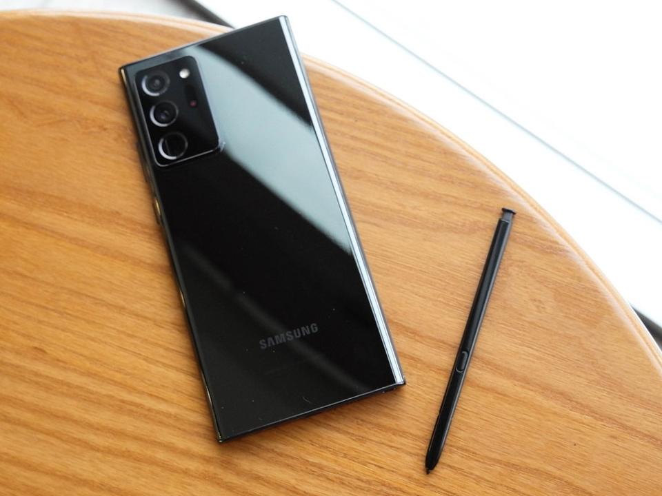 Samsung Galaxy Note 20 Ultra 5G sitting on a table next to its S Pen