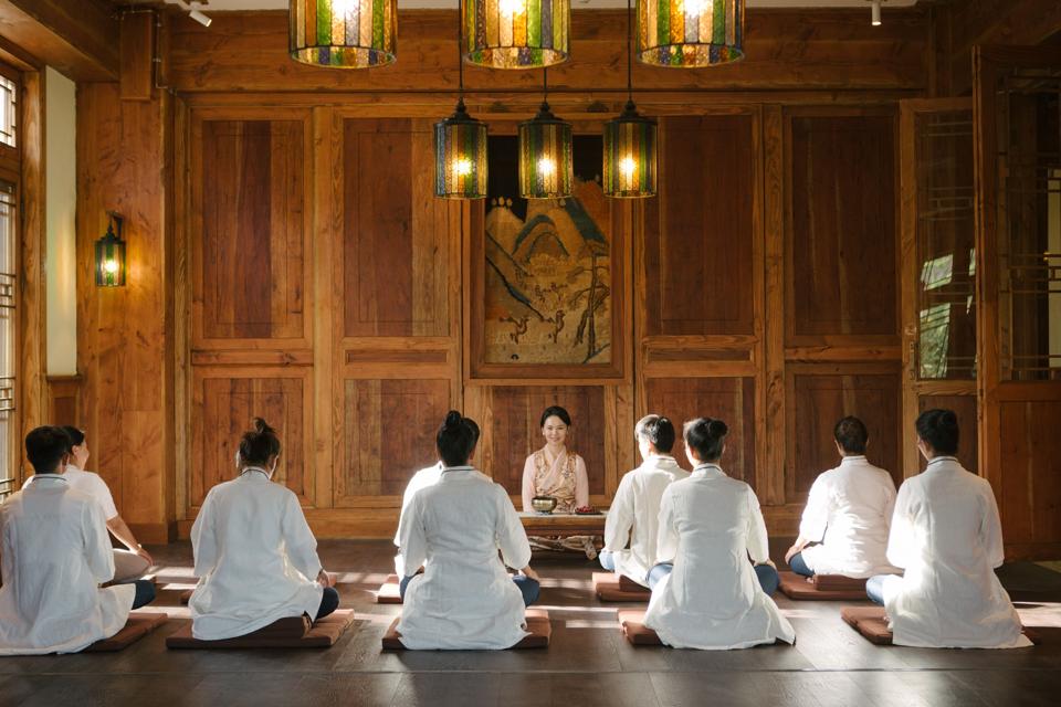Hotel guests meditating at Songtsam Hotels