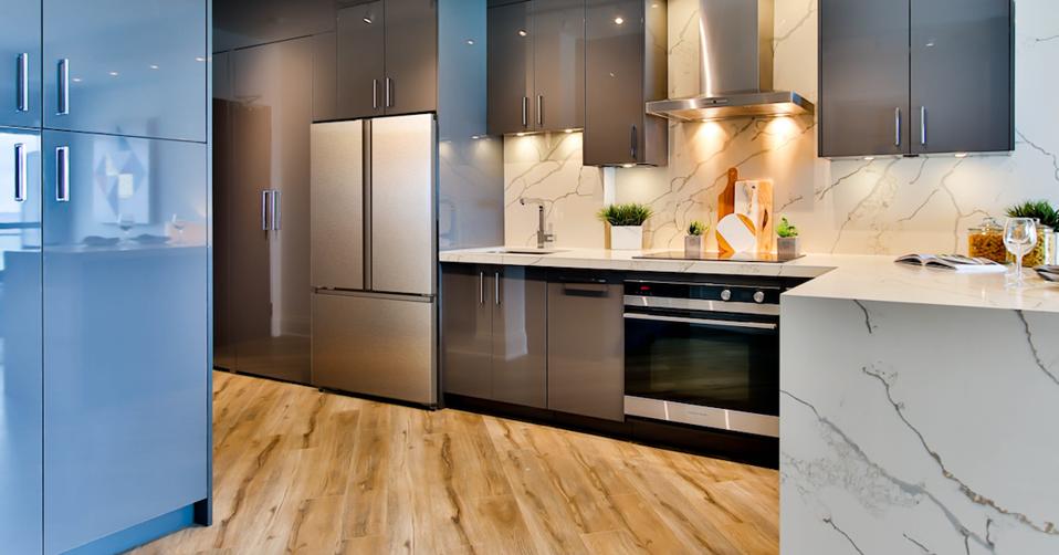 A kitchen with stainless steel appliances and marble