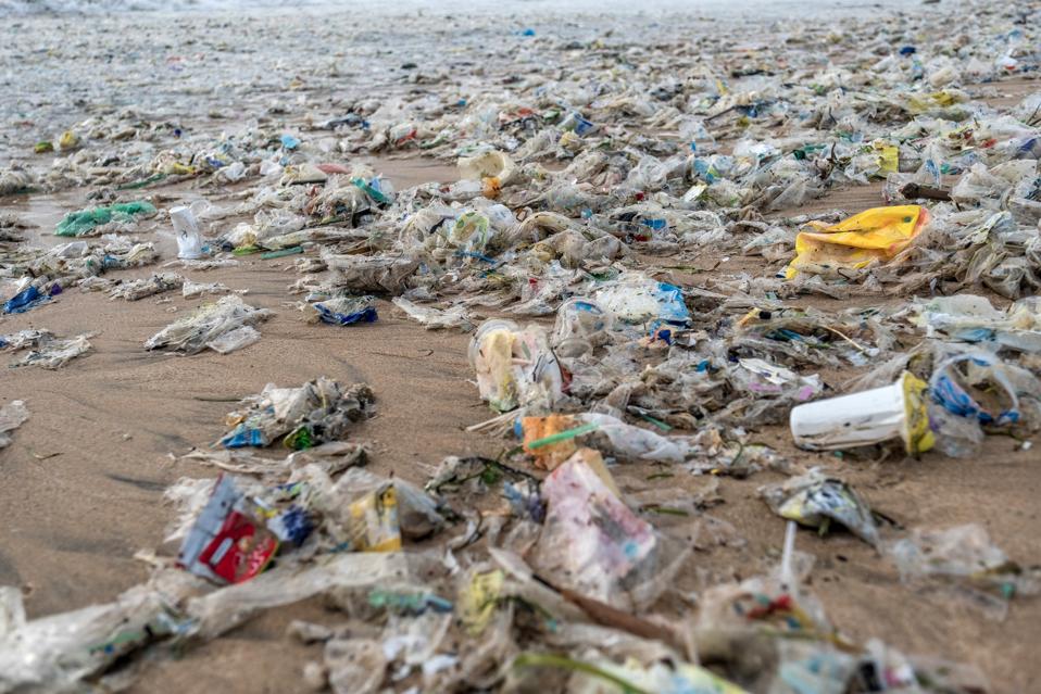 A beach in Bali strewn with plastic trash.