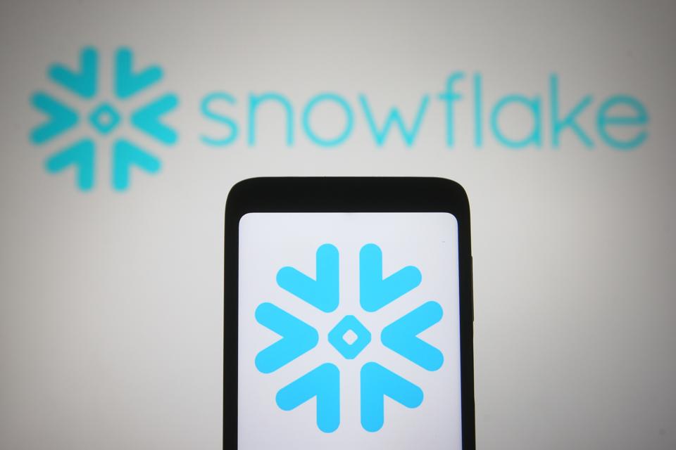 In this photo illustration the Snowflake Inc. logo of a US...